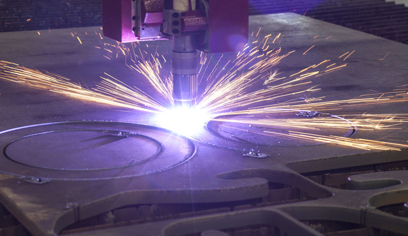 Worker using Oxyacetylene gas to weld in sheet metal factory